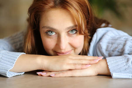 Portrait of a beauty woman with blue eyes looking at you at homeの写真素材