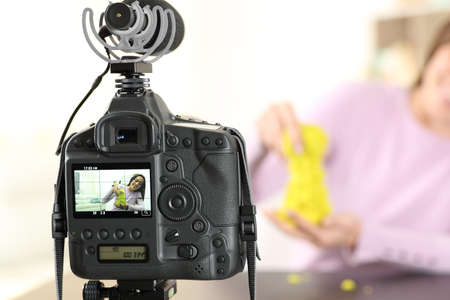 Close up portrait of a dslr camera recording influencer presenting productの写真素材