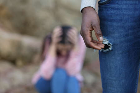 Man with black skin leaving his sad caucasian girlfriend aloneの写真素材