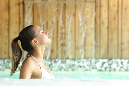 Profile of a teen in spa breathing fresh airの写真素材