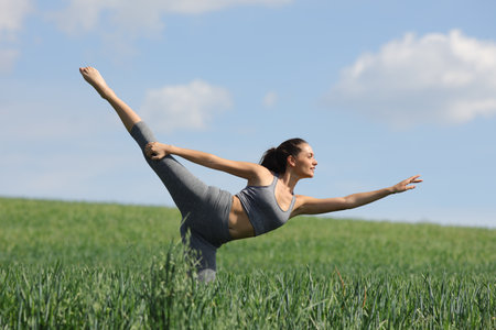 Dancer woman dancing in a wheat fieldの写真素材