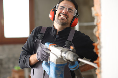 Construction worker is suffering backache after accident in a house renovationの写真素材
