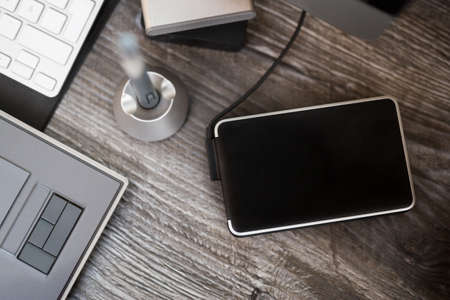 External hard disk with informatics equipment, very selective focus
