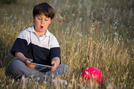 scared boy surfing in the internet, selective focus