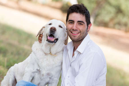 man with old senior labrador dog,selective focusの写真素材