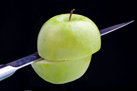 fresh green apple isolated on a white backgroundの写真素材