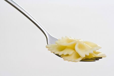 Fork fresh pasta with sauce, tomatoes and oreganoの写真素材