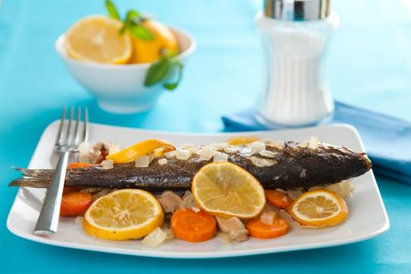 fresh seabass baked with vegetablesの写真素材