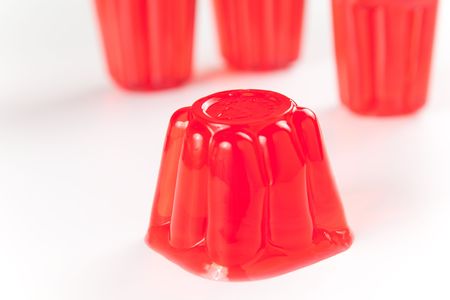 sweet and healthy friuit gelatin isolated over whiteの写真素材