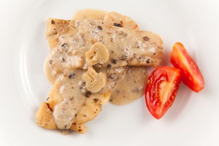 hake fillets with cheese sauce and mushroomsの写真素材