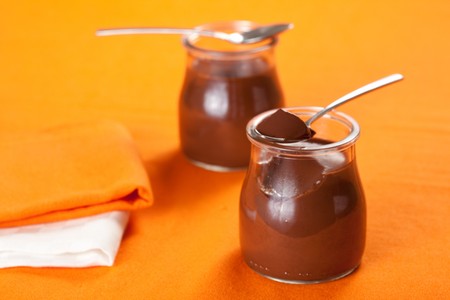 delicious homemade dessert chocolate mousse in glass jarの写真素材