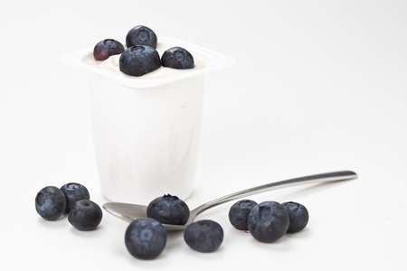 yogurt in plastic box container isolated over white backgroundの写真素材