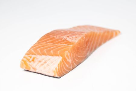A fresh salmon steak on white background.
