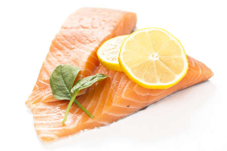 A fresh salmon steak on white background.の写真素材