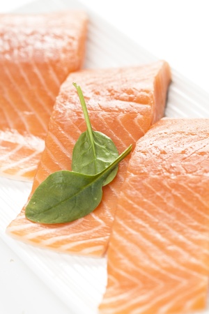 A fresh salmon steak on white background.の写真素材
