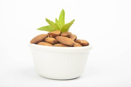 Many almonds isolated on white backgroundの写真素材