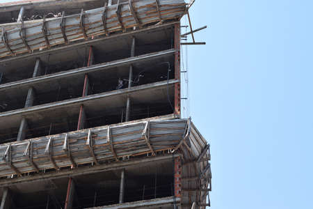 building a tall building, a skyscraper, in the summer in clear weatherの写真素材