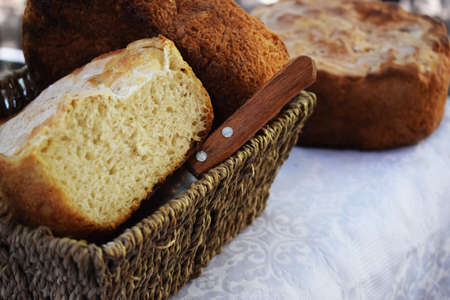 homemade bread on a tray with a knife