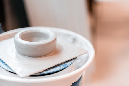Ceramic blown being made from clay in a wheel. Arts and crafts concept. Handmade object.