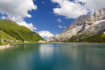The artificial lake and pass of Fedaia (Dolomites, Trentino, Italy), at summerの写真素材