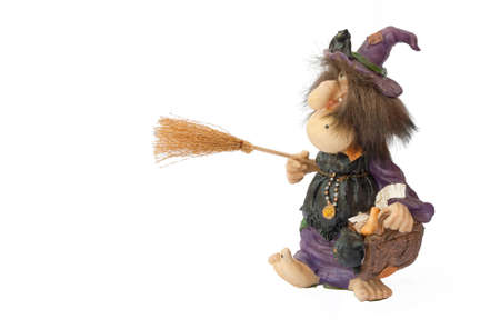 antique statuette representing an old witch isolated on white backgroundの写真素材