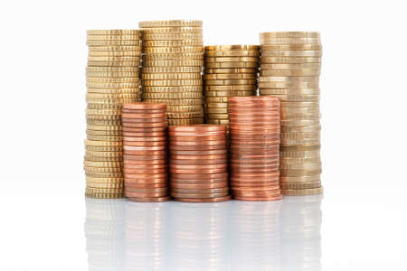 euro currency piled up with one euro, fifty, twenty, ten, five, two and one cent coins, isolated on...