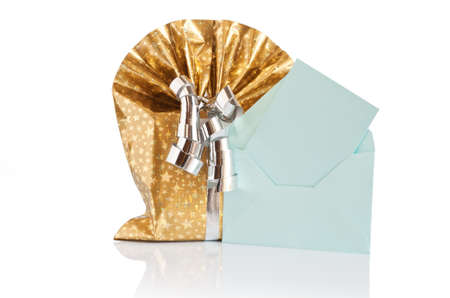 golden gift box with silver ribbon and green letter 