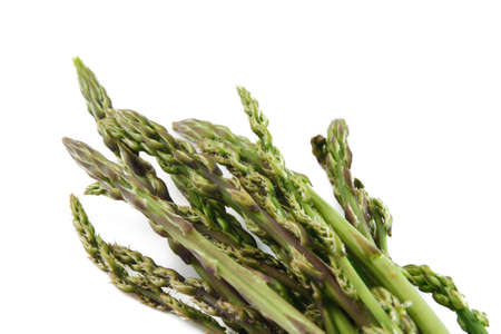bunch of wild asparagus over white backgroundの写真素材