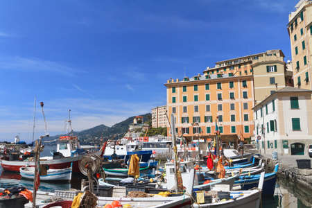 typical small port with fishing boats in Camogli, Italyの写真素材