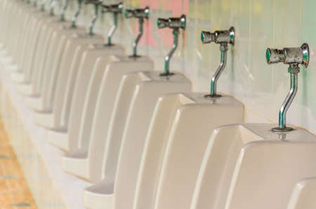 old tap urinal in rest room./ dirty of metal.の写真素材