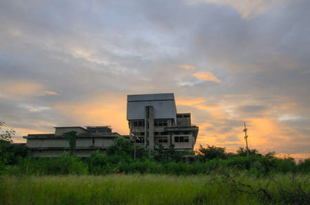 Abandoned Industrial Buildings with sun rise background.の写真素材