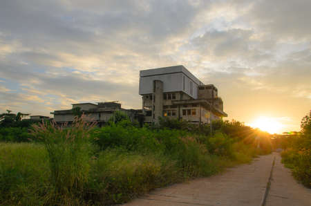 Abandoned Industrial Buildings with sun rise background.の写真素材