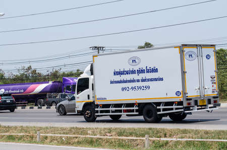 Samut Sakhon, Thailand - April 2019: A small white truck running on Rama 2 Road on April 6, 2019 in Samut Sakhon, Thailand.のeditorial素材