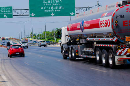 Samut Sakhon, Thailand - May 2019: Oil Truck of Esso Oil transport running on Phutthasakorn Road on 5 May 2019 at Samut Sakhon, Thailandのeditorial素材