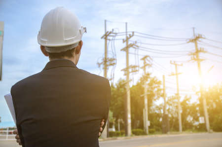 Electrical engineers standing at the job siteの写真素材