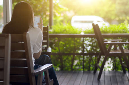 Asian women use smartphones to search for tourist information.の写真素材