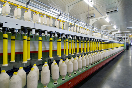 Deep perspective of textile spinning machine in factoryの写真素材