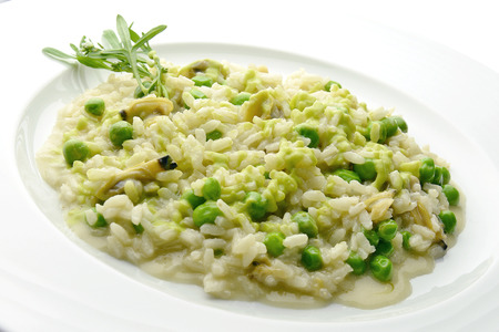 Plate of Risotto with Clams and Peas in white plateの写真素材