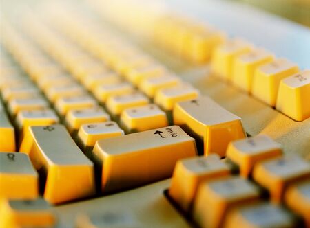 Keyboard Computer, Focus on Enter button with warm colored lightの写真素材