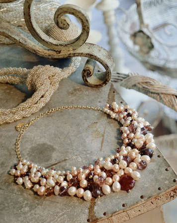 Necklace with Pearls and red amber on old tableの写真素材