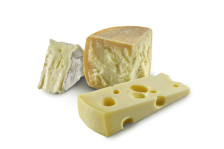 Tris of slices Cheeses on white planeの写真素材
