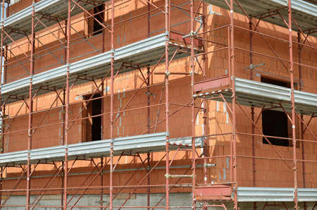 building site house under construction with red bricks