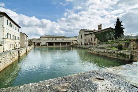 Tuscan landscape Siena hills with cloudy skyの写真素材