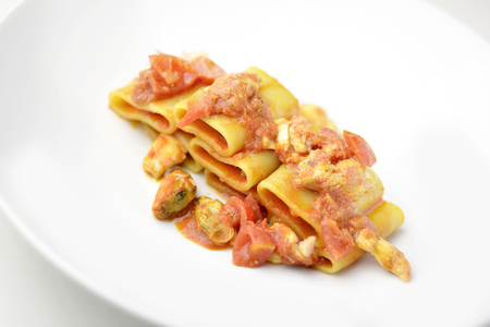 Isolated Dish of Paccheri pasta with seafood chowder sauceの写真素材