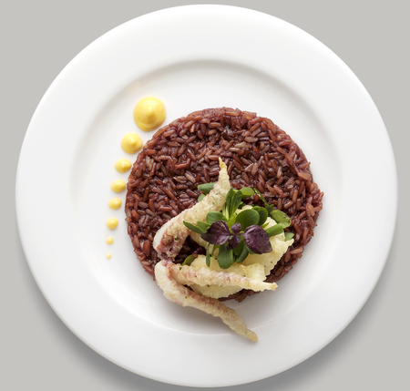 Dish of red rice, fish tempura and sprouts top viewの写真素材