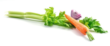 Celery carrot and onion isolated on whiteの写真素材