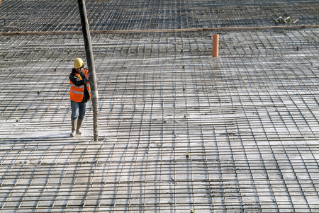 Milan, Italy - January 17, 2016 - Concrete casting on Reinforcing Bar of floor in industrial Construction siteのeditorial素材