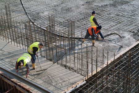 Milan, Italy - January 17, 2016 - Concrete casting on Reinforcing Bar of floor in industrial Construction siteのeditorial素材