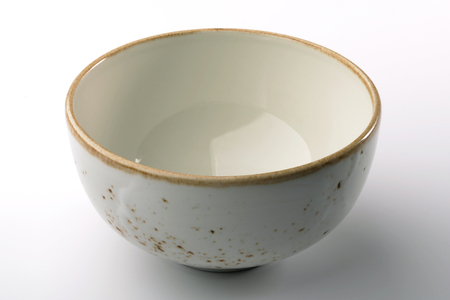 White hand-crafted bowl isolated on white backgroundの写真素材