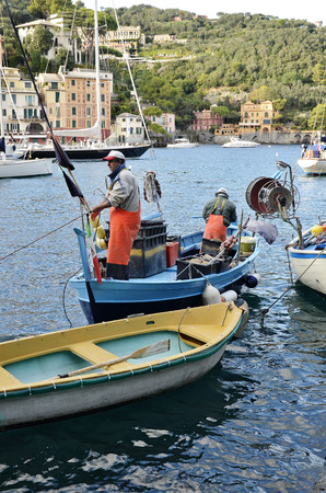 Portofino, Italy -October 11, 2016:  Small fishing boat returns to portのeditorial素材